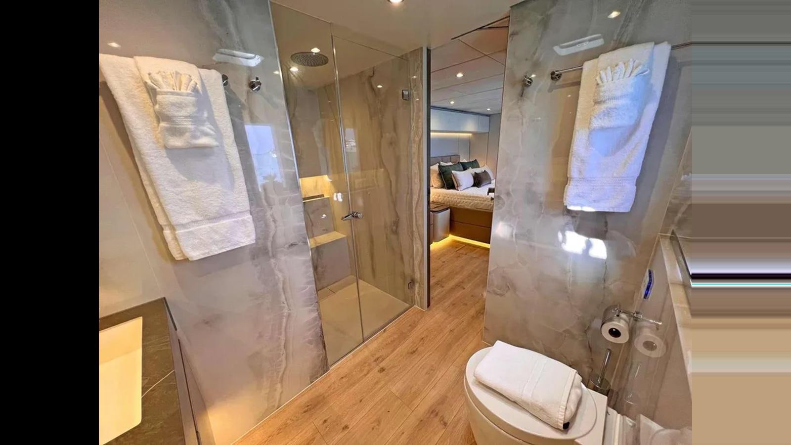 a bathroom with a glass shower aboard SEACLUSION Yacht for Sale