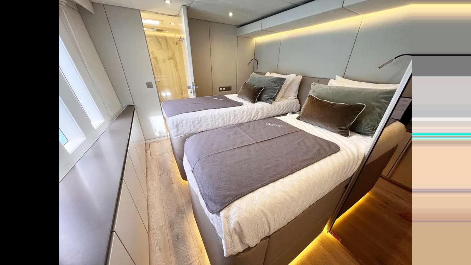 a room with two beds aboard SEACLUSION Yacht for Sale