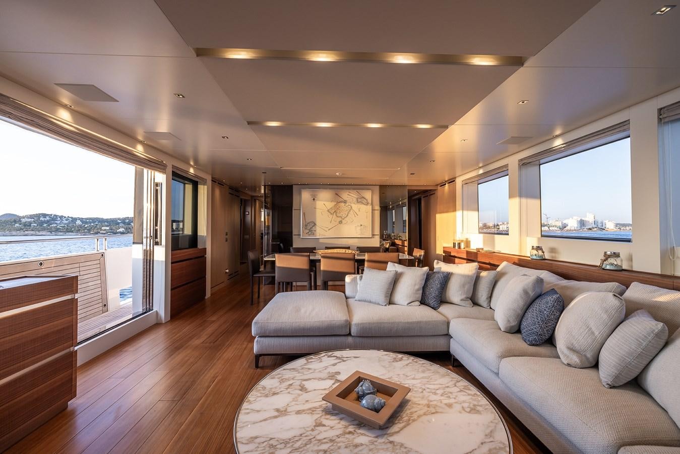 a living room with a large window aboard COBANA Yacht for Sale