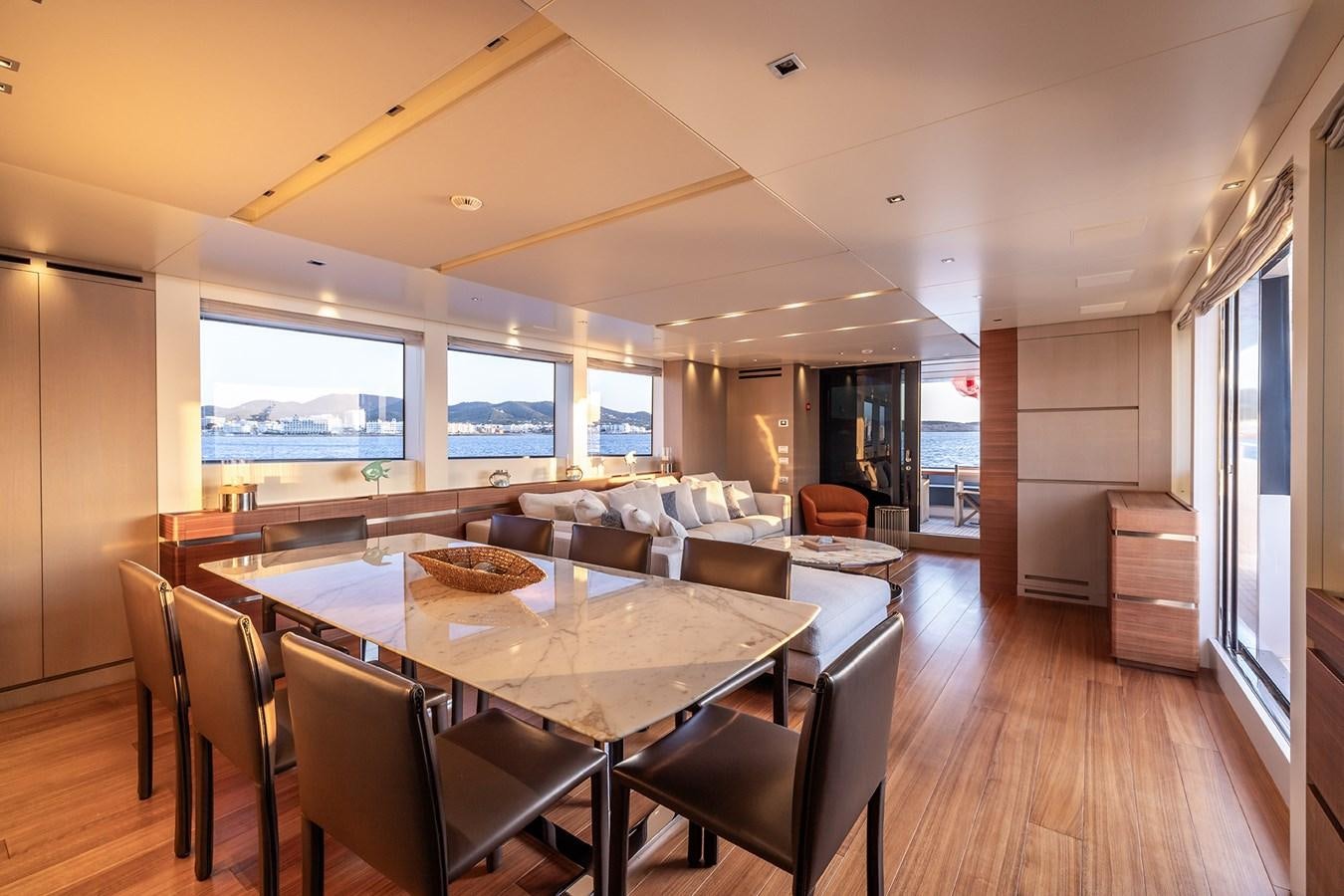 a large dining room with a large window aboard COBANA Yacht for Sale