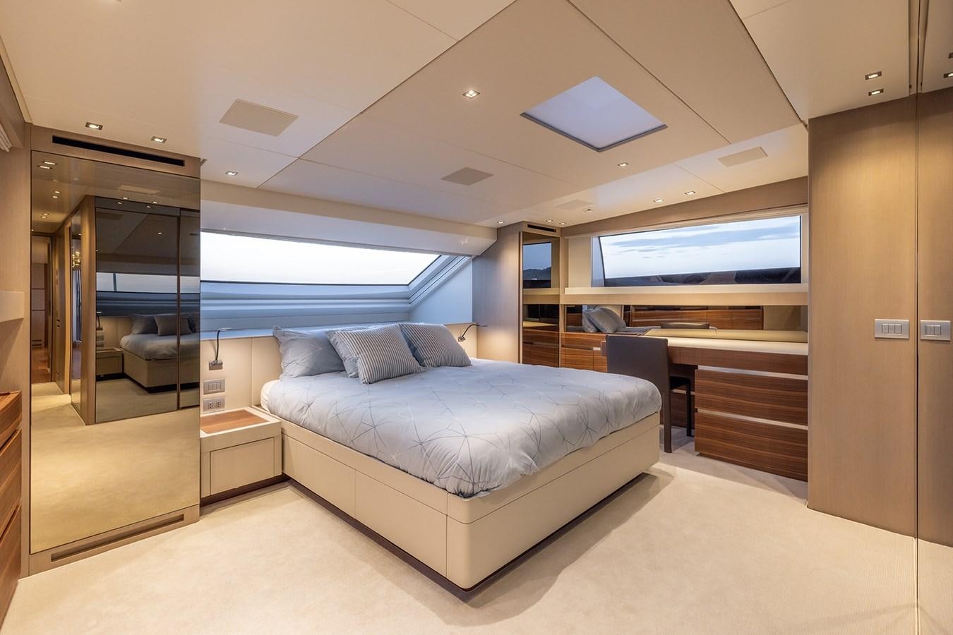 a large bed in a room aboard COBANA Yacht for Sale