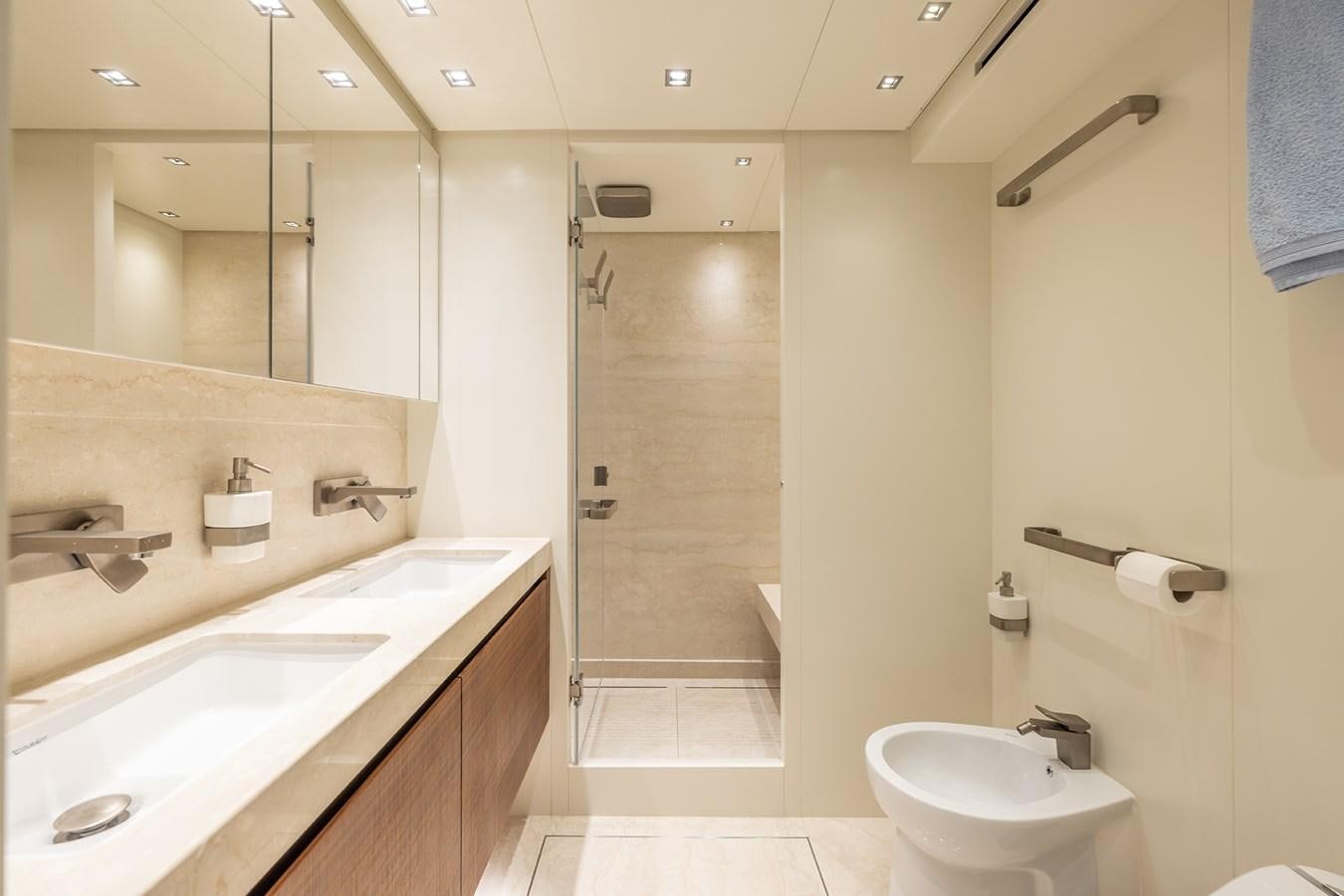 a bathroom with a shower and sink aboard COBANA Yacht for Sale