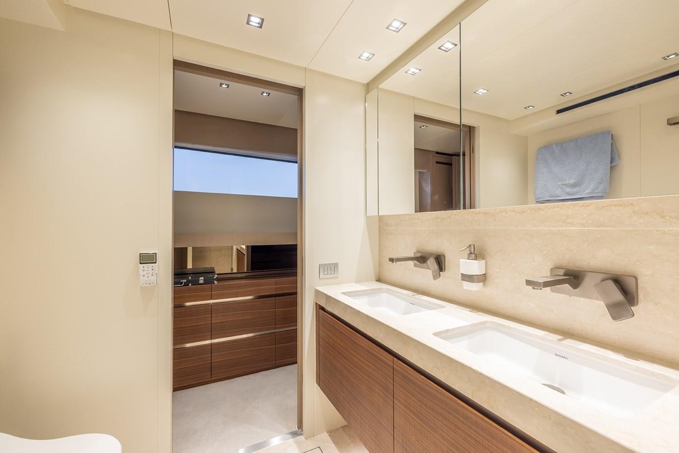 a bathroom with a sink and a mirror aboard COBANA Yacht for Sale