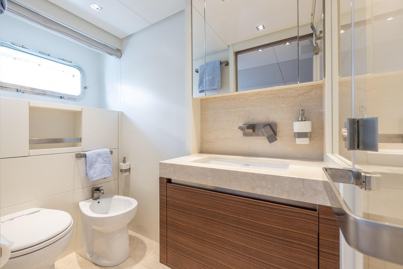 a bathroom with a large mirror aboard COBANA Yacht for Sale