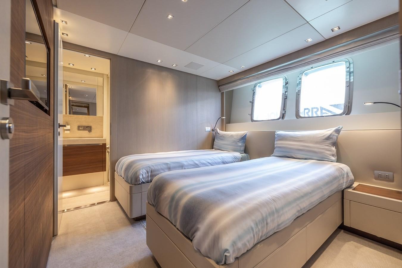 a room with a bed and a door aboard COBANA Yacht for Sale