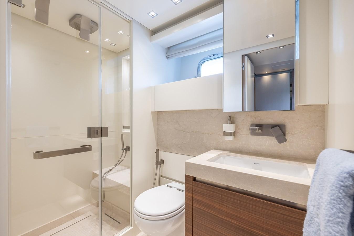 a bathroom with a glass shower aboard COBANA Yacht for Sale