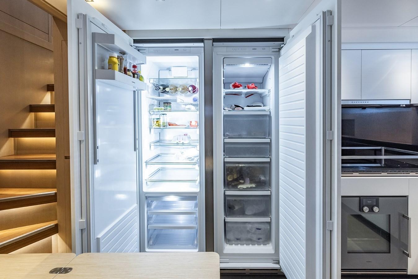 a refrigerator with its door open aboard COBANA Yacht for Sale