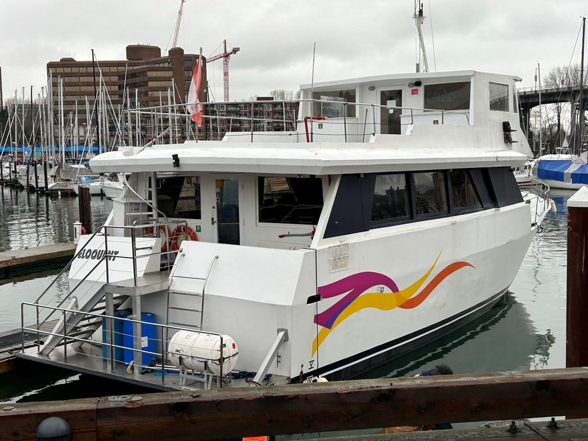 a boat docked at a pier aboard 1990 PALMER MARINE 68 Yacht for Sale