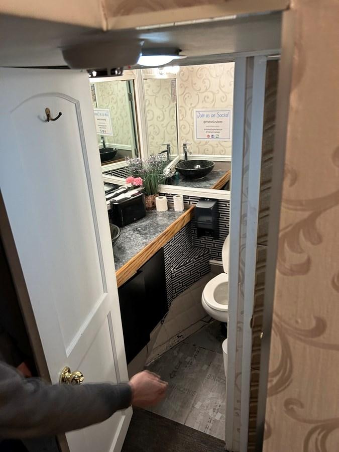 a person holding a refrigerator aboard 1990 PALMER MARINE 68 Yacht for Sale