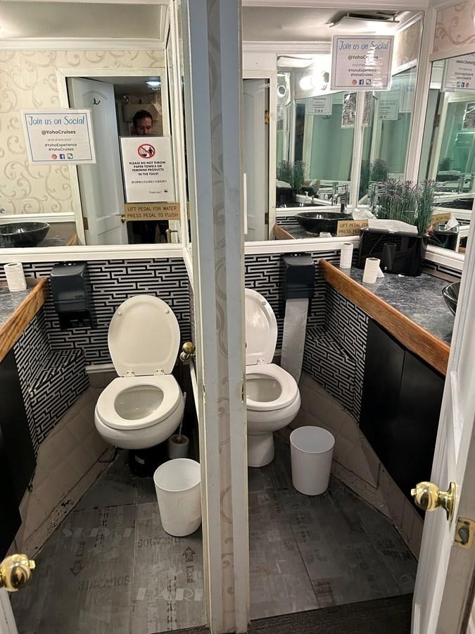 a bathroom with a couple of toilets aboard 1990 PALMER MARINE 68 Yacht for Sale