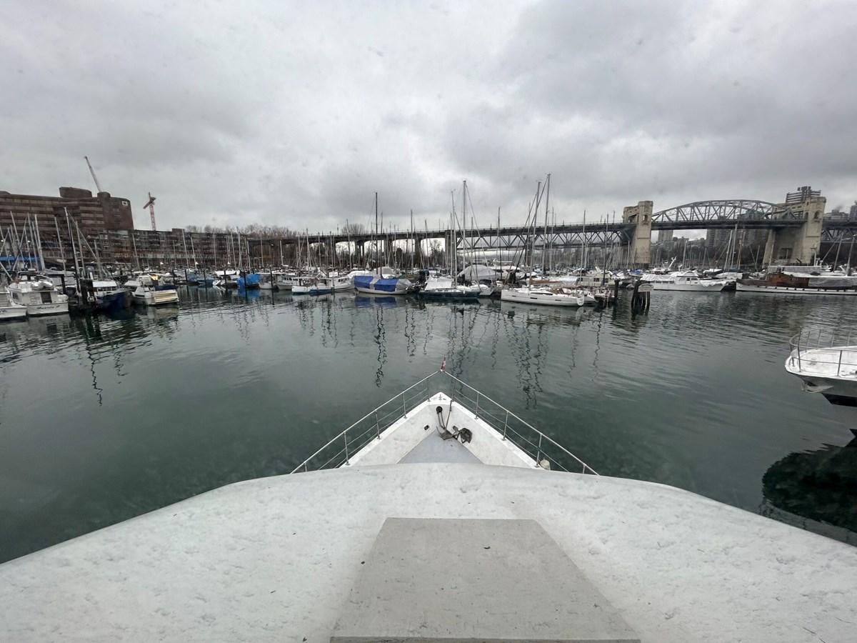 a body of water with boats and buildings along it aboard 1990 PALMER MARINE 68 Yacht for Sale