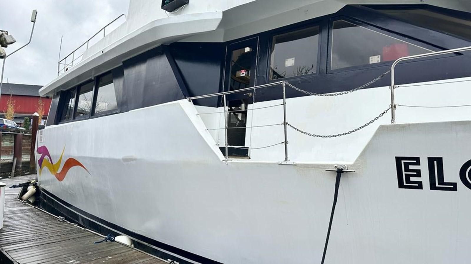 a white boat with a window aboard 1990 PALMER MARINE 68 Yacht for Sale