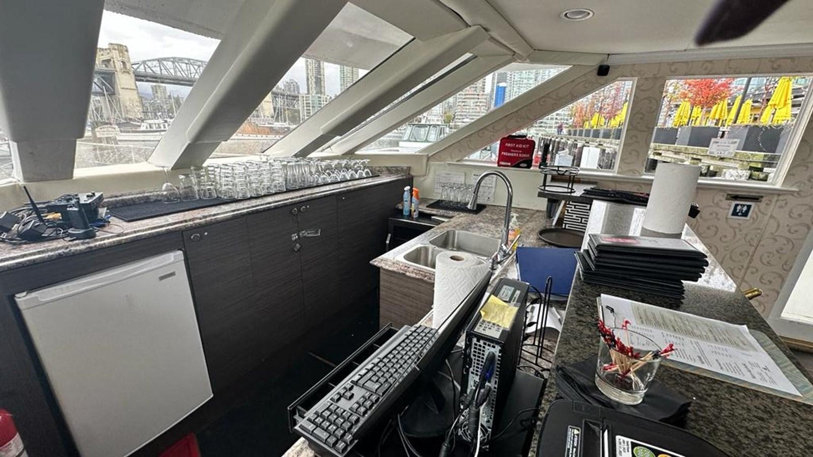 a room with a desk and computer aboard 1990 PALMER MARINE 68 Yacht for Sale