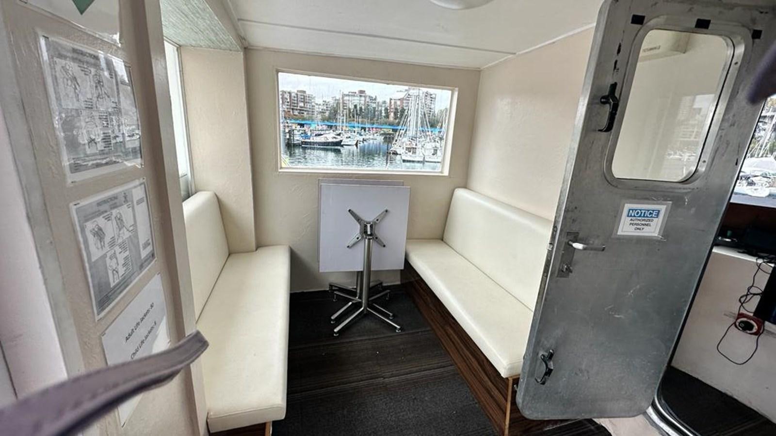 a room with a bed and a chair aboard 1990 PALMER MARINE 68 Yacht for Sale