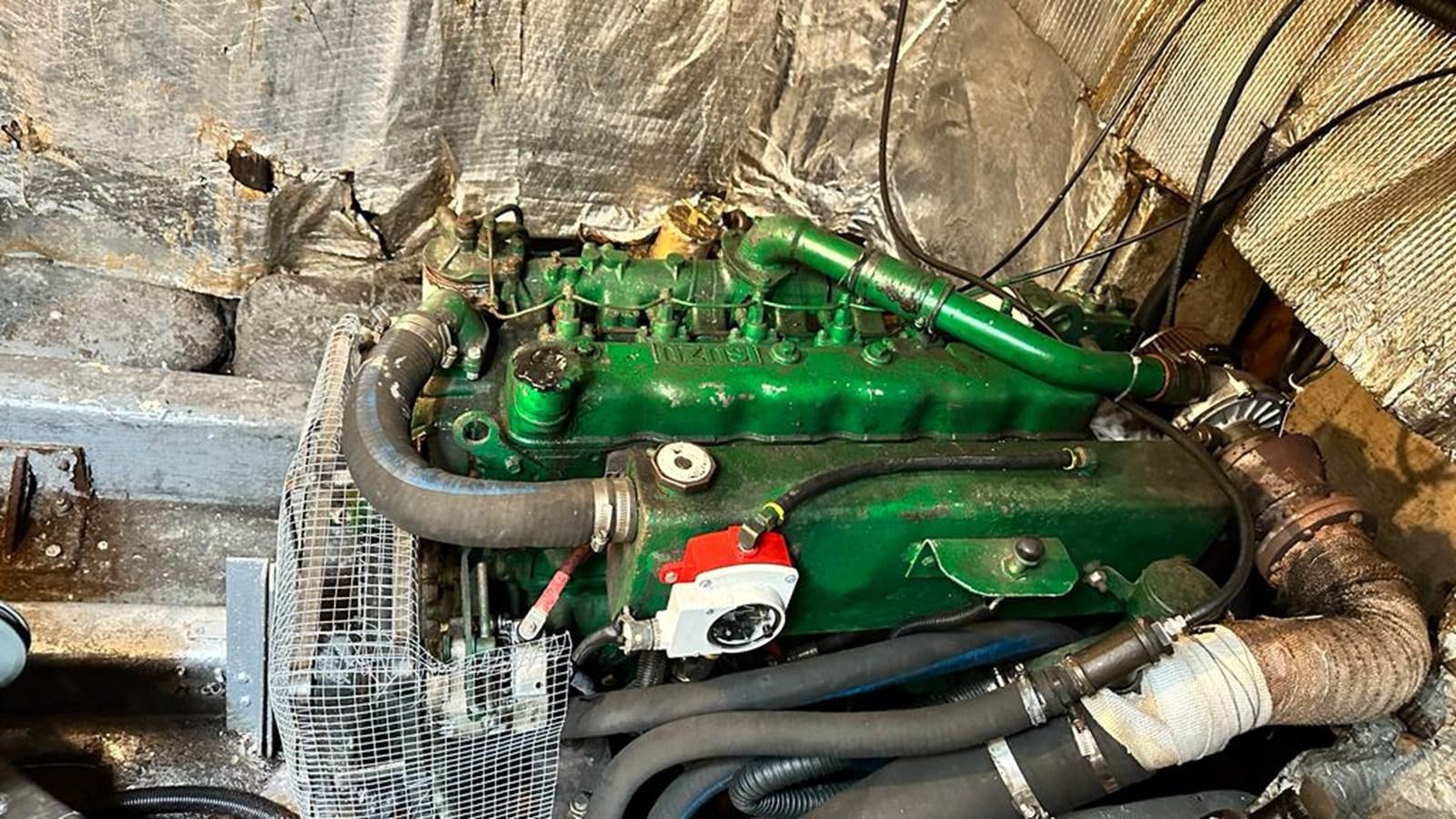 a green car in a metal box aboard 1990 PALMER MARINE 68 Yacht for Sale