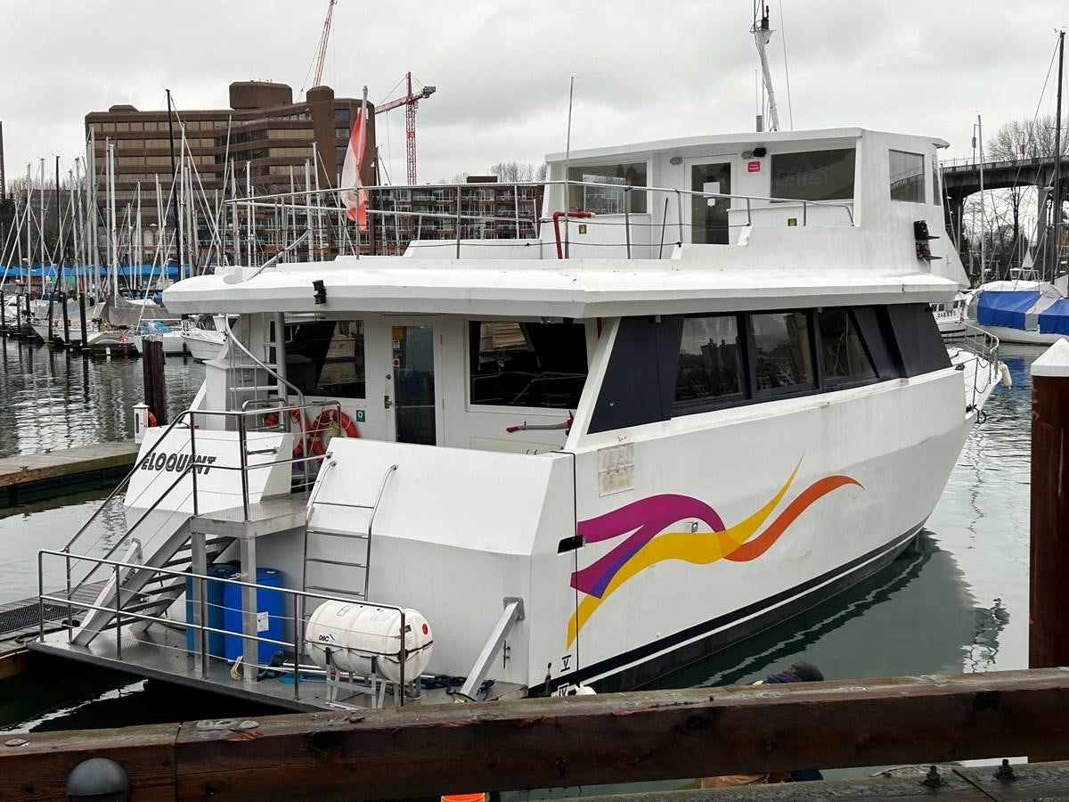 a boat docked at a pier aboard 1990 PALMER MARINE 68 Yacht for Sale
