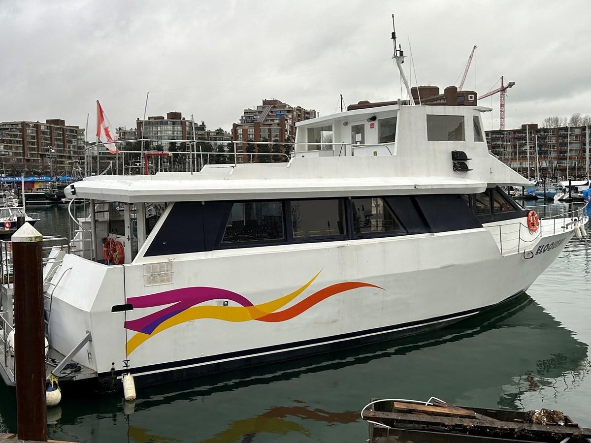 a white boat in a harbor aboard 1990 PALMER MARINE 68 Yacht for Sale
