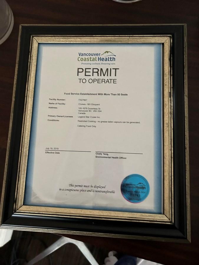 a framed picture of a book aboard 1990 PALMER MARINE 68 Yacht for Sale