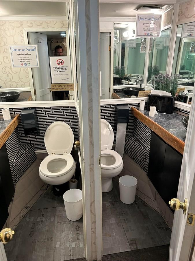 a bathroom with a couple of toilets aboard 1990 PALMER MARINE 68 Yacht for Sale