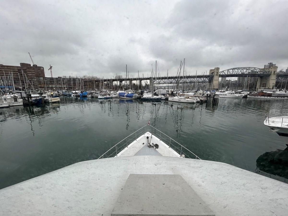 a body of water with boats and buildings along it aboard 1990 PALMER MARINE 68 Yacht for Sale