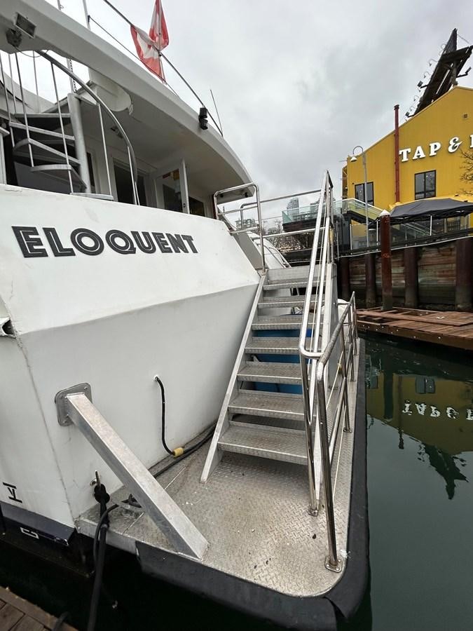 a boat docked at a pier aboard 1990 PALMER MARINE 68 Yacht for Sale