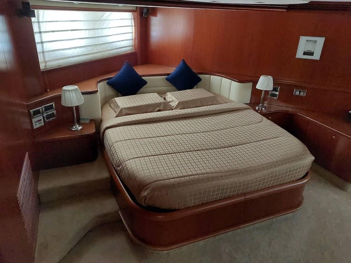 a bed in a room aboard AUGUST MOON Yacht for Sale