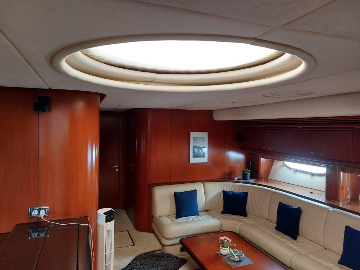 a room with a couch and a table aboard AUGUST MOON Yacht for Sale