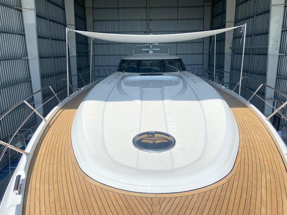 a white car on a wooden platform aboard AUGUST MOON Yacht for Sale