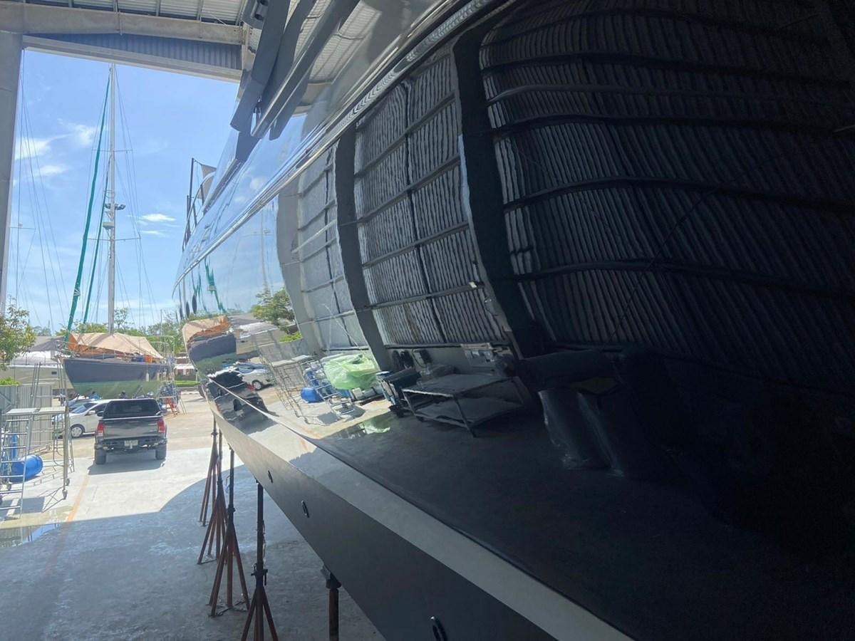 a large metal structure with cars parked in it aboard AUGUST MOON Yacht for Sale