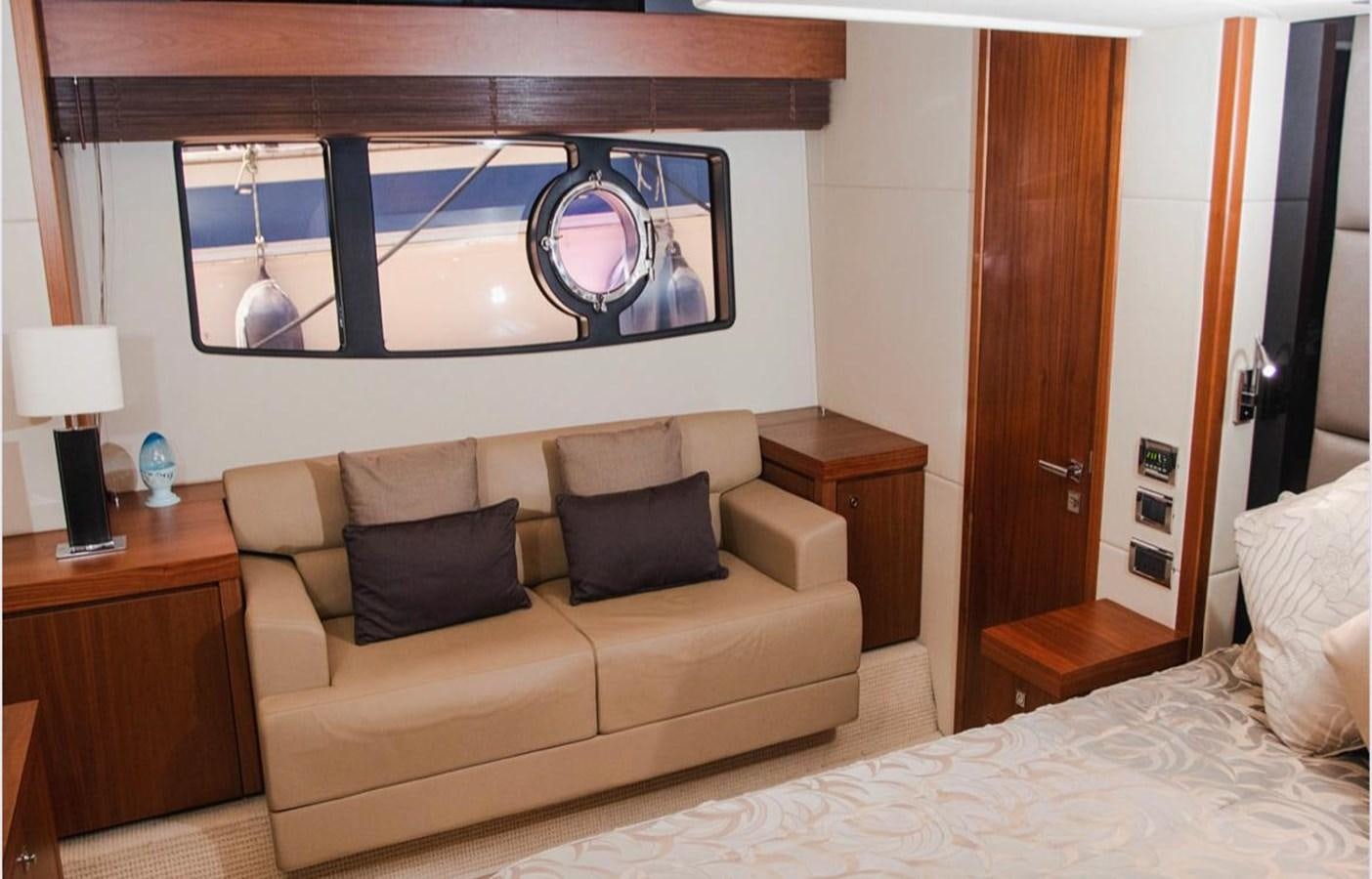 a living room with a couch and a tv aboard 2012 SUNSEEKER MANHATTAN 63 Yacht for Sale