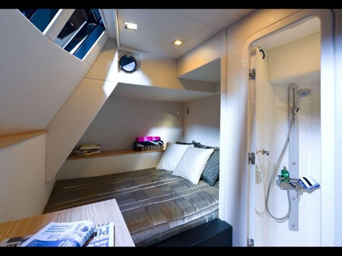 a room with a bed and a door aboard 2012 SUNSEEKER MANHATTAN 63 Yacht for Sale