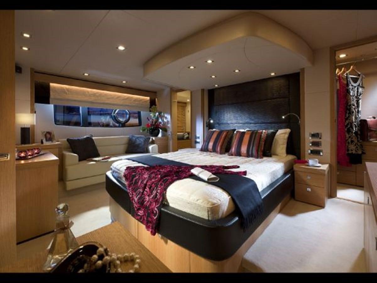 a bedroom with a bed and a couch aboard 2012 SUNSEEKER MANHATTAN 63 Yacht for Sale