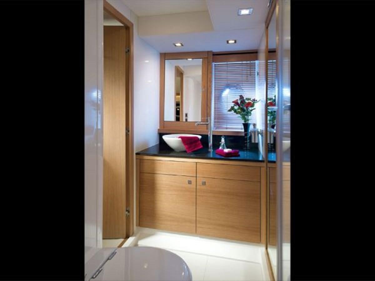 a bathroom with a sink and cabinets aboard 2012 SUNSEEKER MANHATTAN 63 Yacht for Sale