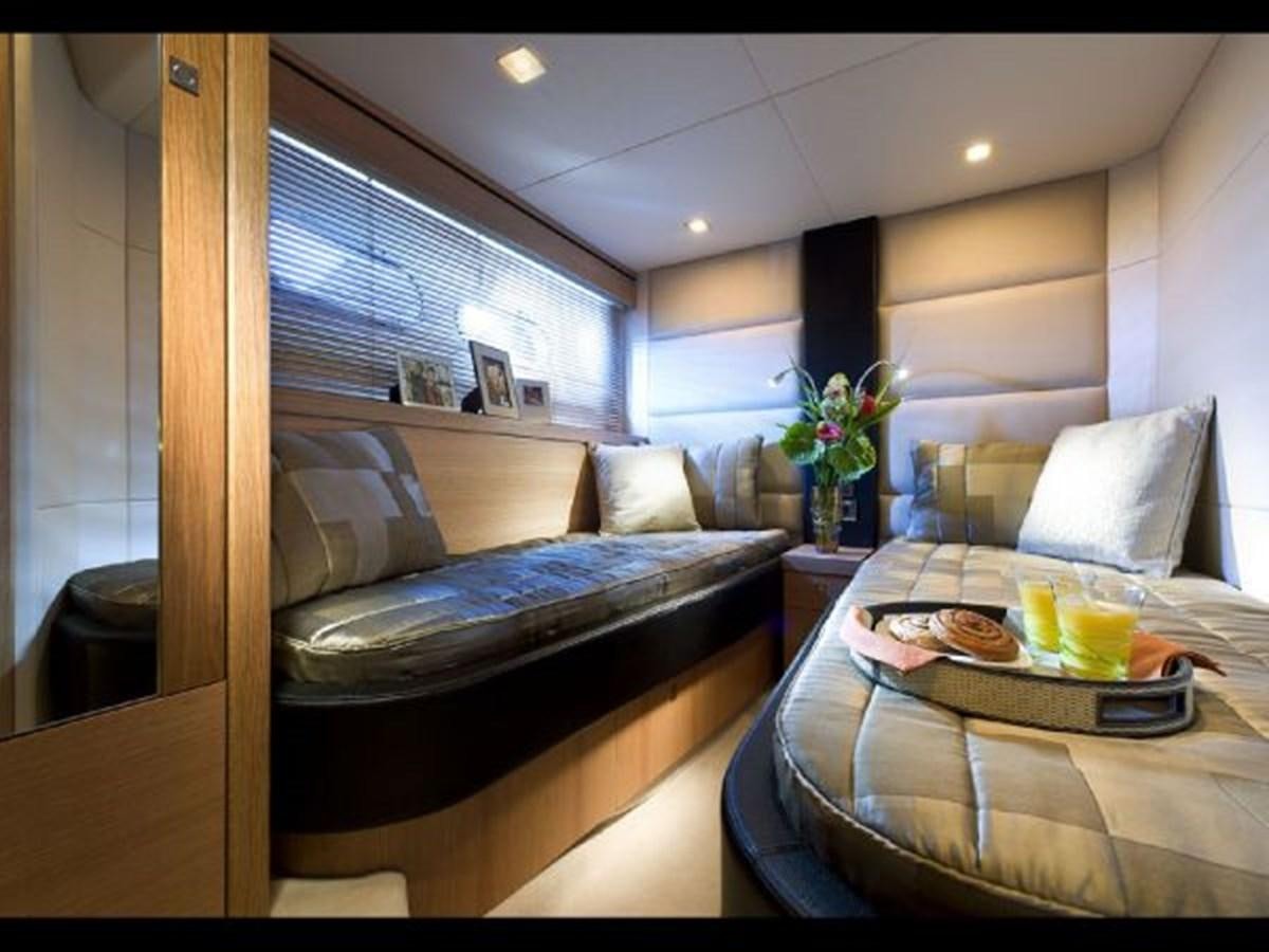 a living room with a couch and a coffee table aboard 2012 SUNSEEKER MANHATTAN 63 Yacht for Sale