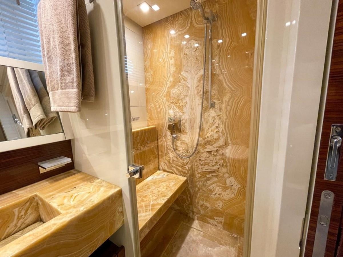 a bathroom with a shower curtain aboard ELAN Yacht for Sale