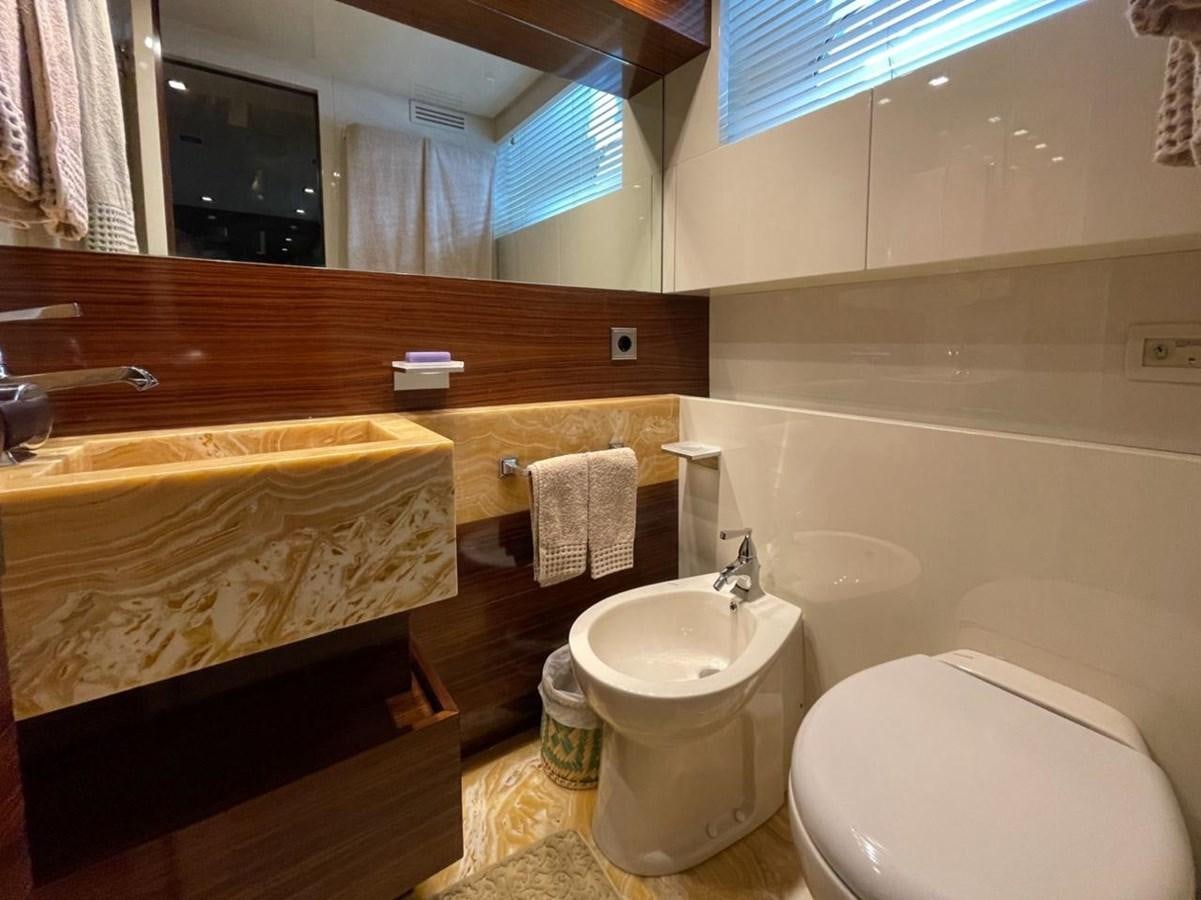 a bathroom with a large mirror aboard ELAN Yacht for Sale