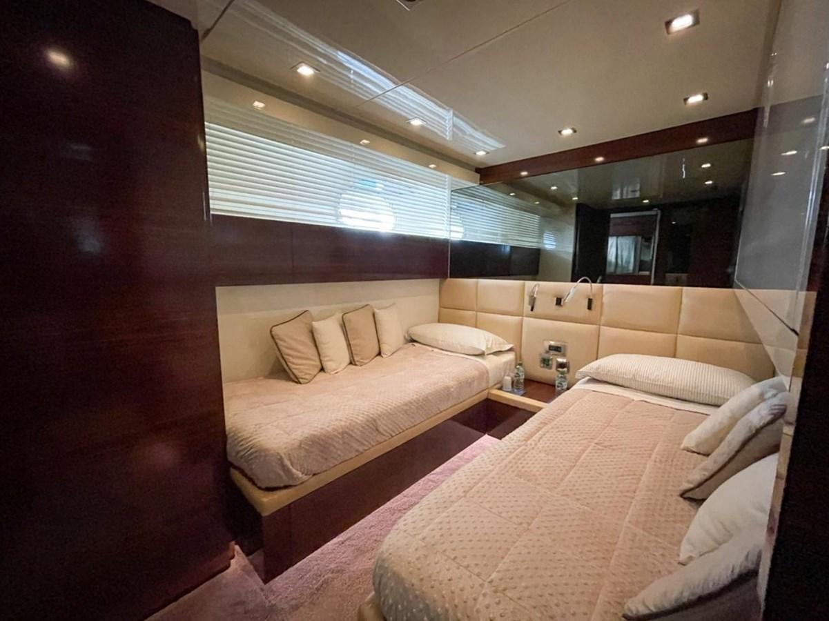 a room with two beds aboard ELAN Yacht for Sale
