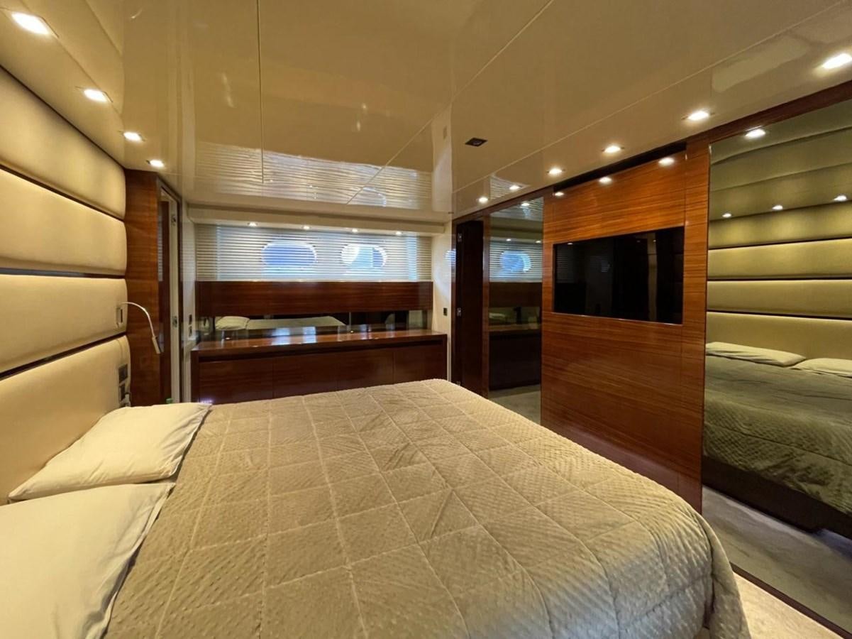 a room with a bed and a tv aboard ELAN Yacht for Sale