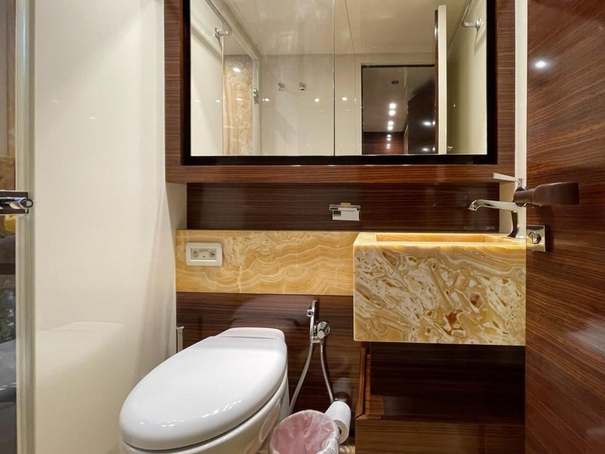 a bathroom with a tub sink and toilet aboard ELAN Yacht for Sale
