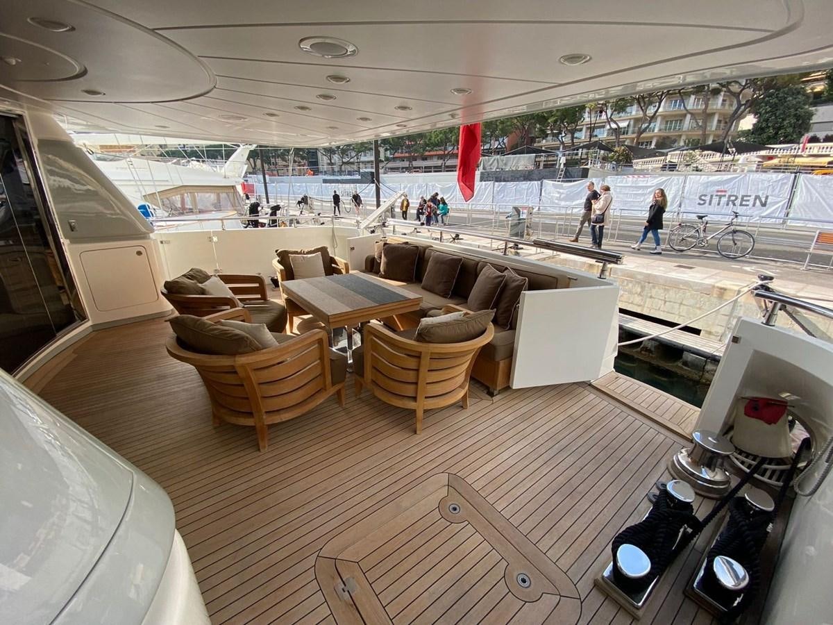 a large room with tables and chairs aboard ELAN Yacht for Sale