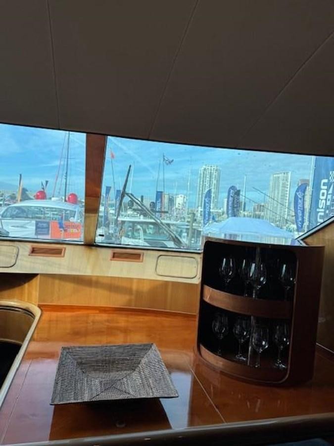 a glass of beer on a table aboard CLASSIFIED Yacht for Sale