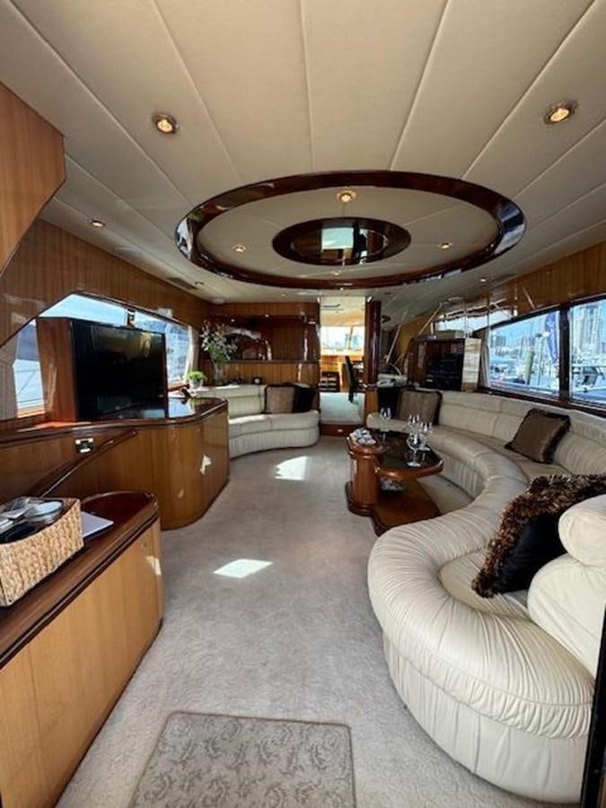 a living room with a large chandelier aboard CLASSIFIED Yacht for Sale