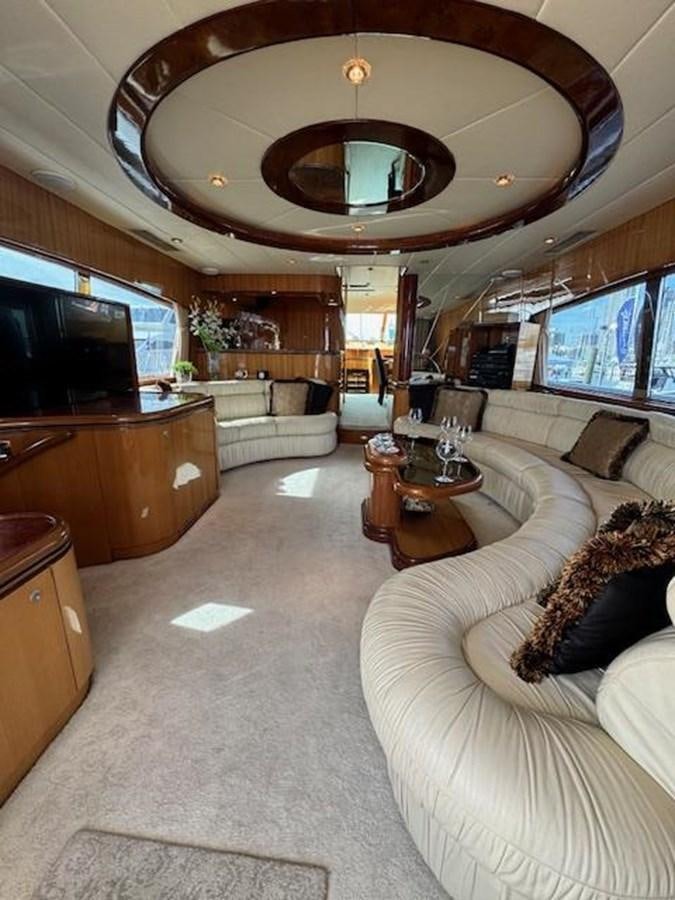 a living room with a large chandelier aboard CLASSIFIED Yacht for Sale
