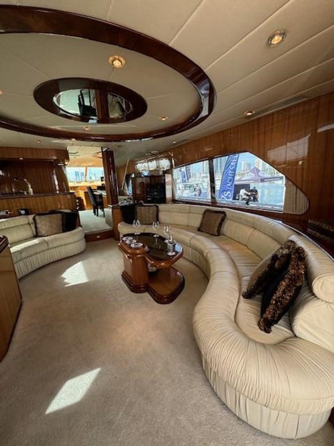 a living room with a large fireplace aboard CLASSIFIED Yacht for Sale
