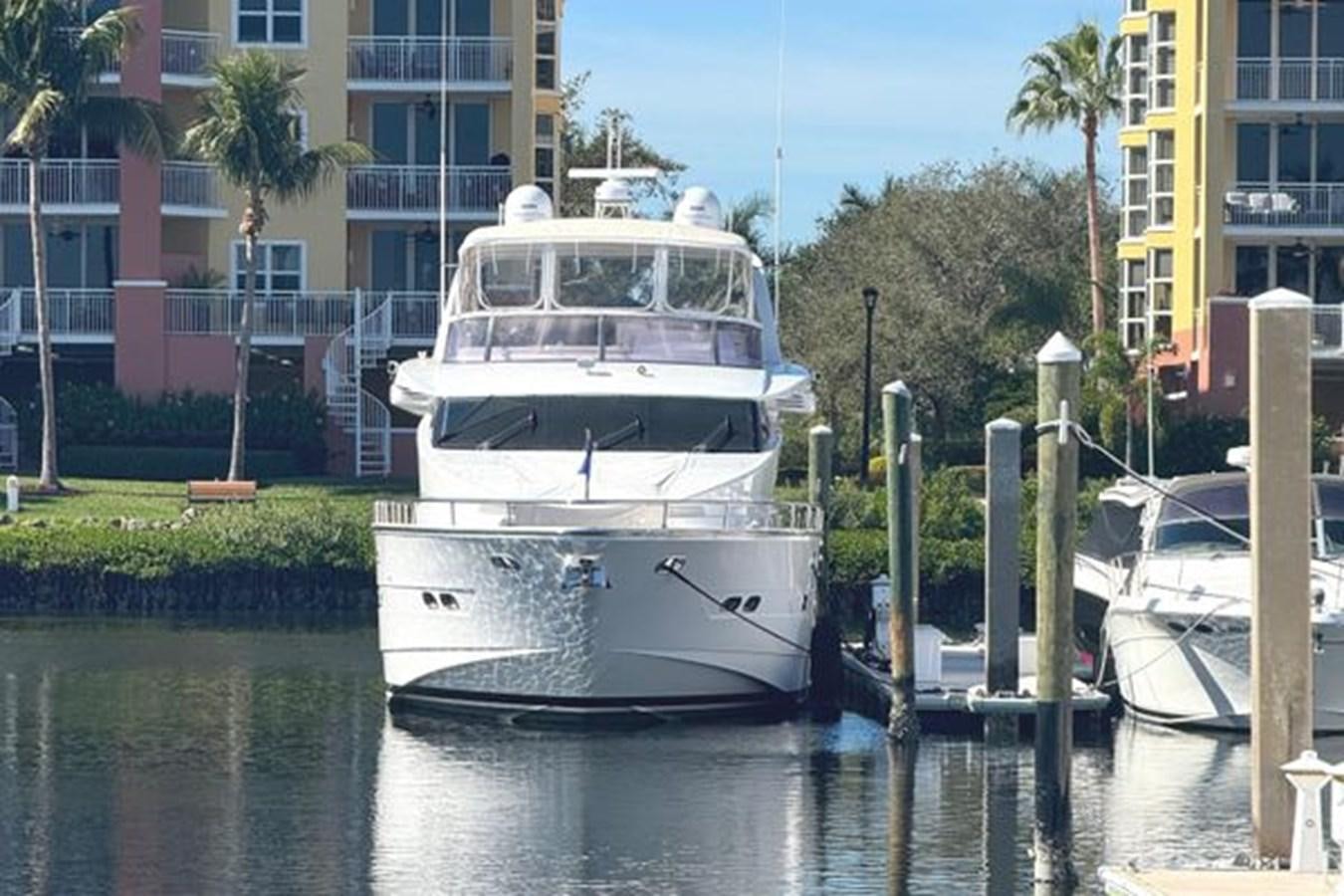 a large white boat in a harbor aboard CLASSIFIED Yacht for Sale