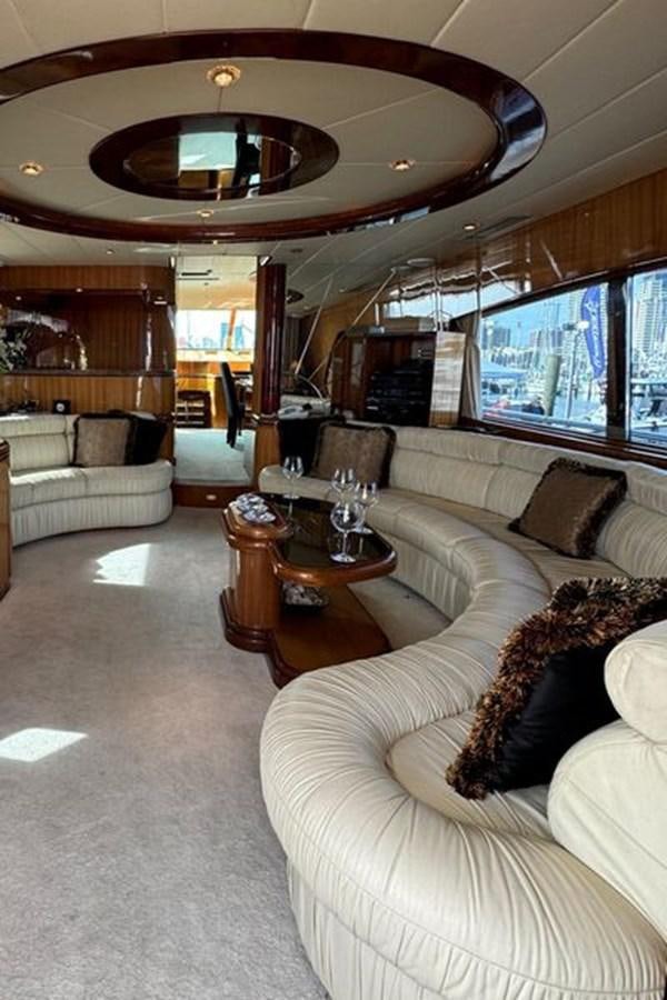 a living room with a large chandelier aboard CLASSIFIED Yacht for Sale