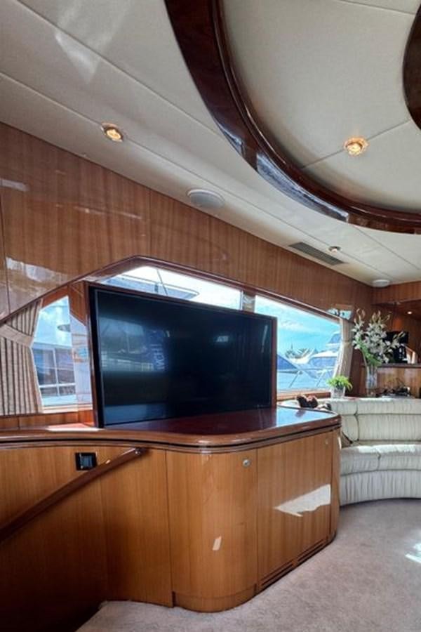 a tv on a wooden stand aboard CLASSIFIED Yacht for Sale