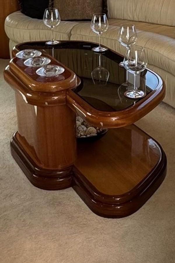 a wooden coffee table aboard CLASSIFIED Yacht for Sale