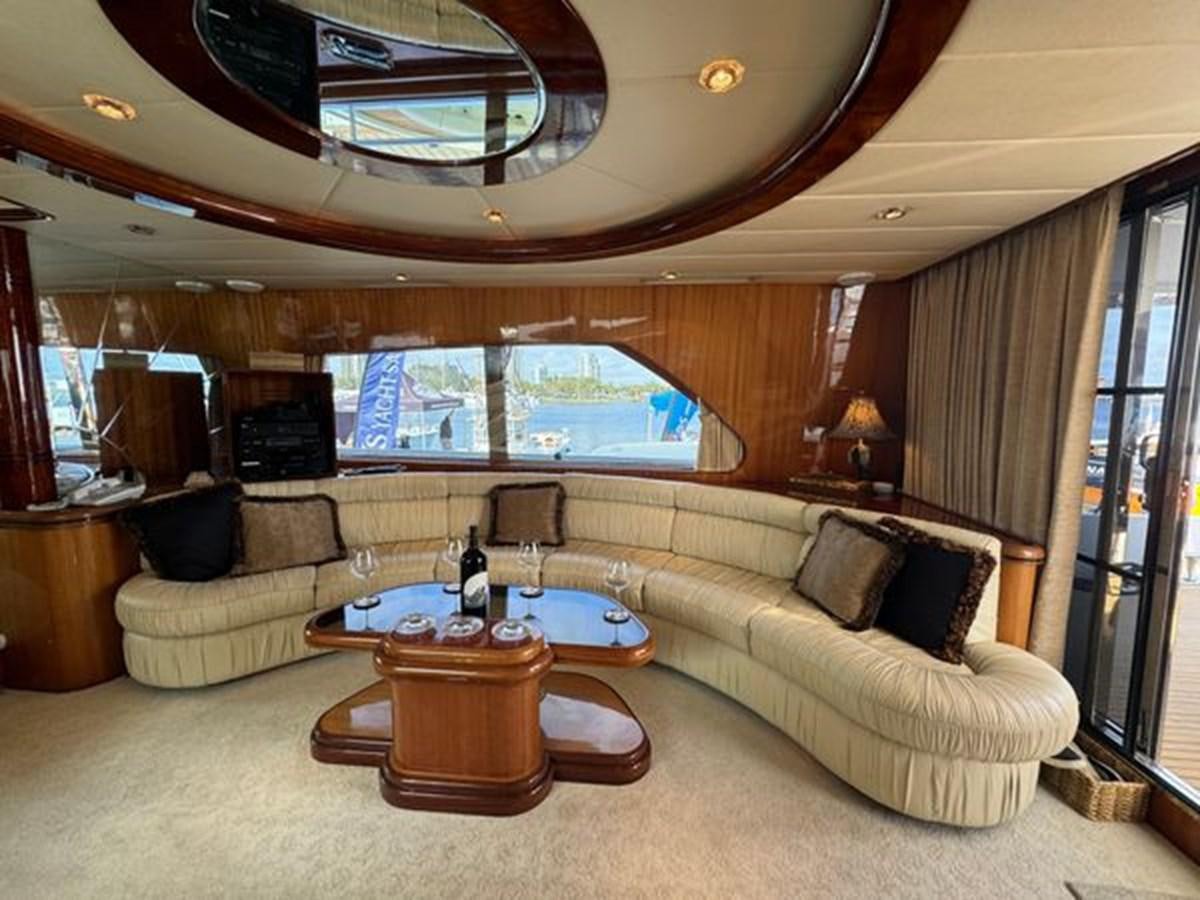 a living room with a large window aboard CLASSIFIED Yacht for Sale