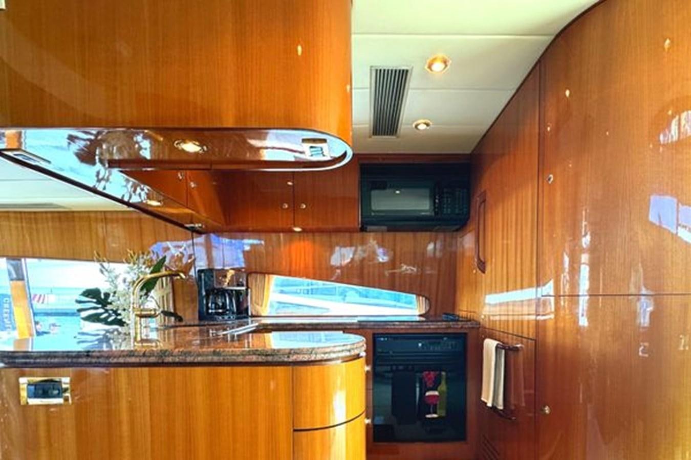 a kitchen with a sink and cabinets aboard CLASSIFIED Yacht for Sale